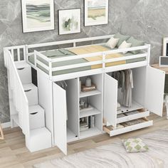 a white loft bed with stairs and storage drawers in front of a gray marble wall