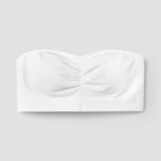 Whether it's for everyday wear or a special occasion, the Girls' Strapless Bandeau Bra from Cat & Jack™ provides comfort, support and style for your young fashionista. This bandeau bra in white provides a secure fit without the need for straps for wearing under a variety of outfits. Easy to wear, the girls' strapless bandeau bra from Cat & Jack™ features a pullover style for hassle-free dressing. Cat & Jack™: Kids’ clothing with an imagination of its own Fitted Casual Cotton Bra, Casual Fitted Cotton Bra, White Seamless Casual Bra, Casual Fitted Seamless Bra, White Fitted No-show Bra, White Stretch Bra With Seamless Design, Seamless Cotton Bandeau Tube Top, Cotton Seamless Bandeau Tube Top, Seamless Fitted Casual Bra