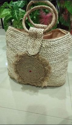 A handmade jute bag is a durable and eco-friendly bag that is made from natural jute fibers. These bags come in a variety of colors, sizes and styles, and are perfect for carrying items to the beach, shopping, or anywhere else. They feature sturdy handles made from jute or cotton, and often have a cotton lining with an interior pocket. They are often decorated with hand-painted designs, or embroidery, to give them a unique and stylish look. Beige Large Capacity Jute Shoulder Bag, Woven Jute Basket Bag, Bohemian Jute Beach Bag With Large Capacity, Beige Jute Shoulder Bag With Large Capacity, Large Capacity Jute Straw Shoulder Bag, Large Capacity Jute Shoulder Straw Bag, Large Capacity Jute Beach Bag Basket Shape, Natural Jute Crochet Bag For Daily Use, Woven Jute Bag For Market