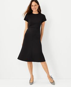 Elevate your wardrobe with the Ann Taylor Midi Flare Dress, a testament to sophisticated style blended with comfort. This dress is meticulously crafted to offer a flattering fit-and-flare silhouette that gracefully hits below the knee, making it a versatile choice for various occasions.

- **Size**: 0 (Regular fit)
- **Color**: Classic Black
- **Material**: Shell - 78% Polyester, 15% Rayon, 7% Spandex; Lining - 100% Polyester
- **Length**: 29 1/2" from natural waist
- **Neckline**: Jewel neck
- Midi Flare Dress, Knitted Suit, Women Maxi, Double Knit, Jewel Neck, 50 Fashion, Double Knitting, Flare Dress, Effortless Style