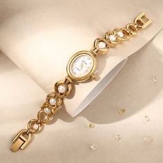 Are you ready to attract everyone's envious gaze? This vintage gold pearl women's watch is like a piece of jewelry in a classic movie, instantly making you the focus of the audience. The golden dial is like the autumn sun, and the pearl-like decoration shines with charming light. Every gaze is like a dialogue with time. The most special thing is that this watch is customized with a name and is purely handmade! 👀 Warm Tips: The watch can be resized by linking the disassembly tool (the disassembl Metal Watch Accessories With Round Dial For Gift, Metal Watches With Bracelet Strap, Metal Watch With Bracelet Strap, Metal Watches Suitable For Gifts, Metal Watches With Round Dial For Gift, Metal Watch With Round Dial For Gift, Metal Watches Gift, Metal Analog Watches With Adjustable Fit, Adjustable Metal Analog Watches