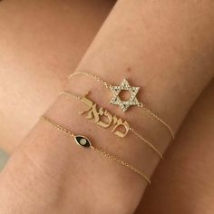 The 14K Gold Personalized Hebrew Nameplate Bracelet is a luxurious piece of jewelry to adorn your wrist. Crafted from 14k solid gold, the bracelet features a personalized plate with a Hebrew name of your choice, to add a unique touch of sophistication and modern elegance. Wear this classic and timeless piece of jewelry to show off your personal style. For personalization, enter the Hebrew name in the designated box. If you are unable to type in Hebrew, please use Google Translator to convert you Nameplate Bracelet, Ear Art, Feminine Necklace, Cuban Link Necklace, Safety Pin Earrings, Diamond Evil Eye, Medallion Necklace, Diamond Star, Initial Jewelry