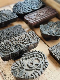 several carved wooden objects on a table