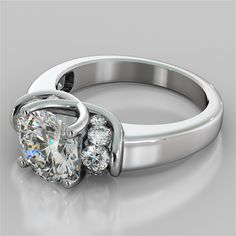 a diamond ring with three stones on the side