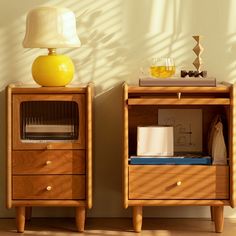 two nightstands side by side, one with a lamp on top