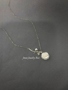 Sweet white shell rose and silver branch necklace. Very dainty but sturdy. White shell rose is double sided and 12mm wide. Silver branch and rose are on an 18'' stainless steel chain with lobster clasp. *Stainless steel chain *Silver brass branch *12mm Shell rose *Handmade with love <3 Like Jmesjewelrybox on Facebook for updates on new jewelry, upcoming sales and giveaways! Plus Facebook fans save 5% :D Find the coupon code on Jmesjewelrybox's cover photo https://www.facebook.com/Jmesjewelryb Silver Dainty Necklace With Rose Design, Dainty Silver Jewelry With Rose Design, Dainty Silver Necklace With Rose Design, Dainty Silver Necklaces With Rose Design, Dainty Silver Rose Design Necklaces, Silver Flower-shaped Necklace With Rose Design, Sterling Silver Rose Design Necklace For Weddings, Sterling Silver Flower Necklace With Rose Design, Delicate White Sterling Silver Necklace