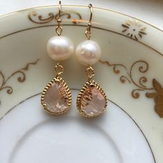 Gold Freshwater Pearl Champagne Blush Earrings Pink Peach Jewelry - Bridesmaid Earrings - Wedding Jewelry Earrings measure approximately 1.5 inches long and are made with 14k gold filled earwires. Can be made in silver. Shipped in a gift box for easy gift giving. Gold Dangle Bridesmaid Earrings, Gold Dangle Earrings For Bridesmaids, Gold Dangle Bridal Earrings For Bridesmaid, Delicate Gold Earrings For Bridal Shower, Elegant Gold Earrings For Bridesmaids, Round Bridal Earrings With Ear Wire, Pink Teardrop Pearl Earrings For Wedding, Gold Dangle Earrings For Bridal Shower, Pear Shaped Hypoallergenic Pearl Wedding Earrings