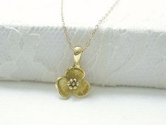 Gold flower necklace- simple dainty necklaceThree petal flower charm hangs on a dainty 14K gold filled chain.  Simple and dainty jewelry, a great everyday necklace.>>>measurements<< Dainty 14k Gold Charm Necklace With Flower Charm, Gold Flower Charm Necklaces For Everyday, Delicate Gold Charm Necklace With Flower, Delicate Gold Charm Necklace With Flower Design, Dainty 14k Gold-filled Flower Charm Necklaces, Dainty 14k Gold-filled Charm Necklaces With Flower Charm, Dainty Yellow Gold Flower Pendant Charm Necklace, Dainty Yellow Gold Charm Necklace With Flower Shape, Everyday Gold Flower Necklace