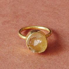 For every November born who desire the gift of protection and strength, this natural citrine ring is a design which proves to be a dream come true. The birthstone comes in a delicate stackable design which leaves no room for any fashion compromise for the wearer making this an ideal gift choice.  Elegant 18K Yellow Gold Plated Natural Raw Citrine Brass Stone Ring, Round Stone Stacking Ring, Unique Birthstone Ring For Women Product Details Item Code: BJBR-1743 Stone Name: Citrine Stone Size: 10 mm Metal: 18K Yellow Gold Plated Over Brass Ring Sizes: Please choose from drop down menu. If you do not see your finger size, select custom and I'll make a ring just for you!  Note:- These rings you will receive may vary slightly in color from the images because these are natural gemstones and vary November Born, Rough Stone Ring, November Birthstone Ring, Precious Stones Rings, Precious Rings, Raw Stone Ring, Ring Stacking, Gold Ring Stack, Citrine Stone