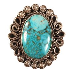 JEWELRY TYPE : Rings METAL : Sterling Silver COUNTRY OF ORIGIN : United States METAL PURITY : .925 SIGNED? : Signed TRIBAL AFFILIATION : Navajo RING SIZE : 6.5 MAIN STONE : Turquoise ARTISAN : Alice Johnson p.p1 {margin: 0.0px 0.0px 8.0px 0.0px; line-height: 28.0px; font: 17.0px Helvetica; color: #000000; -webkit-text-stroke: #000000; min-height: 19.6px}p.p2 {margin: 0.0px 0.0px 8.0px 0.0px; line-height: 28.0px; font: 17.0px Helvetica; color: #000000; -webkit-text-stroke: #000000}span.s1 {font-f Sterling Silver Turquoise Rings With Concho Detail, Sterling Silver Turquoise Ring With Concho, Vintage Sterling Silver Turquoise Ring With Large Stone, Western Sterling Silver Turquoise Concho Ring, Western Style Turquoise Sterling Silver Ring, Western Style Sterling Silver Gemstone Ring, Southwestern Sterling Silver Rings With Large Stone, Western Sterling Silver Gemstone Ring, Southwestern Sterling Silver Ring With Large Stone