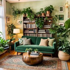 a living room filled with lots of green plants