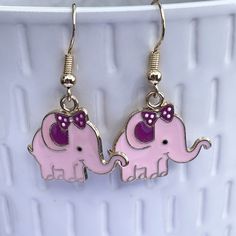 Adorable pink novelty elephant earrings these come on gold plated hooks these make a great gift for lovers of fun quirky earrings. Not suitable for young children due to choking hazard I have lots of other fun earrings  https://hilarysgifts.etsy.com    Please use code SAVE10 when purchasing 5 items from my store for 10% off Adjustable Jewelry With Cute Design Gift, Nickel-free Pink Earrings For Birthday, Pink Novelty Dangle Jewelry, Pink Fun Dangle Jewelry, Fun Pink Dangle Jewelry, Whimsical Nickel-free Pink Earrings, Whimsical Pink Nickel-free Earrings, Pink Drop Earrings For Birthday, Trendy Jewelry With Cute Design For Gift