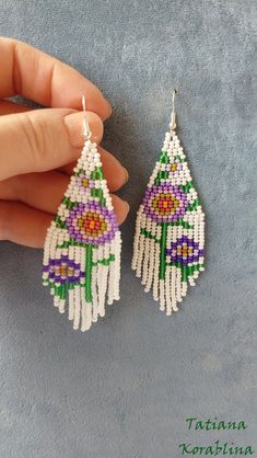 These handmade unique earrings with abstract floral print are made of high-quality Czech beads and strong synthetic thread. I use my author's scheme . They are elegant, fashionable, and highly versatile, suitable for everyday wear. Color: white,pink,purple,red,orange, green . 100% hand made with love! I beg you not to copy my authoring Copy without my permission is prohibited For those who want to buy my copyright scheme for these earrings: https://www.etsy.com/uk/listing/974991392/brick-stitch- Traditional White Flower Earrings, White Dangle Flower Earrings With Colorful Beads, White Flower Dangle Earrings With Colorful Beads, Traditional White Earrings For Summer, Traditional White Chandelier Earrings As Gift, Elegant White Chandelier Earrings With Colorful Beads, Bohemian White Flower Jewelry, Colorful Beaded White Chandelier Earrings, White Dangle Flower Earrings With Beads