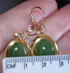 Green jadeite jade oval handmade 14k gold filled lever back earrings aaa welcome to my handmade store: vintage gorgeous pair of 14k gold filled green jadeite jade cz lever back earrings 22mm large dangle connector drops . good size oval jade earrings.. gem quality jade lever back earrings if you are looking for an affoedable pair of genuine green jade dangles, these earrings are for you. a++high polish blush green jade cabs 17 mmm x 12mm cabs length of whole earrings: 37 mm vintage green jade tr Hallmarked Oval Green Jewelry, Green Gemstone Oval Cabochon Earrings, Green Oval Cabochon Gemstone Earrings, Green Cabochon Earrings For Anniversary, Oval Jade Earrings For Anniversary, Green Oval Earrings For Anniversary, Green Oval Earrings For Formal Occasions, Earring Jackets, Jade Earrings