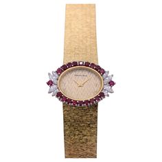 This elegant 18k yellow gold ladies cocktail watch was designed and created in Geneva Switzerland by Bueche-Girod during the 1970's. Featuring an oval head, and herring bone pattern dial with some minor staining, it is surrounded by luxurious round rubies, punctuated by eight fine quality marquise diamonds. Total measure to the outside of the ruby and diamond bezel is 35mm by 24mm. The movement is original to the watch and is a mechanical ultra-thin model. The integral 18k Bueche-Girod light bar Bone Pattern, Cocktail Watch, Vintage Gold Bracelet, Geneva Switzerland, Modern Bracelets, Cuff Watch, Wide Bracelet, Yellow Gold Bracelet, Marquise Diamond