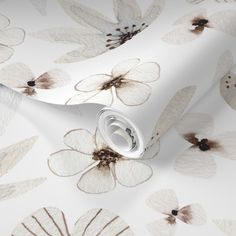 white and brown floral wallpaper with large flowers on the back drop in an elegant pattern