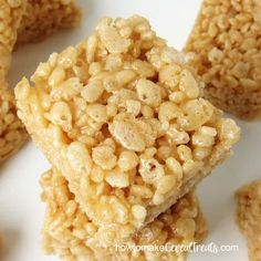 rice krispy treats are stacked on top of each other in the shape of cubes