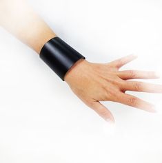 Cool black genuine Italian leather cuff bracelet, a beautiful gift idea for men and women! High bracelet: 2.55'' (6.5 cm) Adjustable closure with snap buottons Suitable for wrist measurement from 5.5'' to 7.5'' (14 / 19 cm) For other amazing gift ideas, please visit here: Napolilab.etsy.com  Made in Napoli with pride Leather Cuff Bracelet, Leather Wristbands, Leather Bracelets, Leather Cuffs Bracelet, Women Leather, Leather Cuffs, Shiny Silver, Gift For Women, Best Friend Gifts