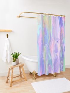 a bath room with a toilet and a bath tub next to a wooden step stool