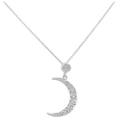 A chic pendant necklace, featuring a crescent moon set with round brilliant cut diamonds weighing 0.51 carat total. Finely made with 14K white gold. Suspended on a white gold chain, 18 inches in length. Perfect for everyday wear. Roman Malakov is a custom house, specializing in creating anything you can imagine. If you would like to receive a special quote on a custom piece, please message or call us. Elegant Crescent White Gold Diamond Necklace, Elegant Diamond Necklace With Moon Phase Detail, Elegant Diamond Necklace With Moon Phase, Elegant Moon Shaped Diamond Necklace, Elegant Moon-shaped Diamond Necklace, Moon Shaped Diamond Necklace With Single Cut Diamonds, White Gold Diamond Necklace With Moon Charm, White Gold Crescent Necklace For Wedding, Moon Shaped Diamond Necklace With Accents