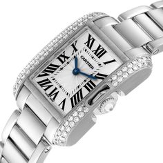 Cartier Tank Anglaise White Gold Diamond Ladies Watch WT100008. Quartz movement. 18k white gold case 30.2 x 22.7 mm. Circular grained crown set with an original Cartier factory diamond. 18k white gold original Cartier factory diamond bezel. Scratch resistant sapphire crystal. Flinque and silvered dial with black Roman numerals. Sword shaped blued steel hands. Secret Cartier signature at X. 18k white gold bracelet with hidden butterfly clasp. Fits 6" wrist. Cartier Designer Diamond Watch, Designer Cartier Diamond Watch, Designer Diamond Cartier Watch, Classic Platinum Diamond Watch With Brilliant Cut, Luxury Cartier Diamond Watch With Diamond Accents, Luxury Cartier Diamond Watch For Anniversary, Cartier Diamond Watch For Wedding, Classic White Gold Diamond Watch With Subdials, Timeless Cartier Diamond Watch With Palladium Hardware