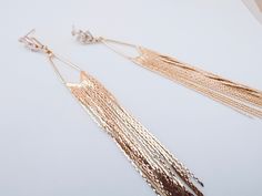 Fringe Tassel earrings, Gold Leaf earrings, Art Deco earrings, Long Chain Tassel earrings, Chain gold earrings, Gift for her Make a statement with these stunning Fringe Tassel earrings. The Art Deco inspired design features long chains of gold leaf tassels, adding an elegant touch to any outfit. Eye-catching design Long chains of tassels Made with high-quality materials The perfect gift for her The Chain Gold earrings are perfect for any occasion, adding a touch of glamour to your look. The long chain tassels complement the gold leaf design, creating an alluring and sophisticated effect. These Fringe Tassel earrings are the ideal gift for your loved one or yourself. They come in a beautiful gift box and are ready to be worn on any special occasion or just as an everyday accessory. Total le Elegant Gold Tassel Earrings, Elegant Gold Dangle Tassel Earrings, Gold Elegant Tassel Earrings For Festival, Gold Dangle Tassel Earrings With Fringe, Elegant Gold Metal Tassel Earrings, Earrings Chain, Gold Leaf Earrings, Deco Earrings, Earrings Art