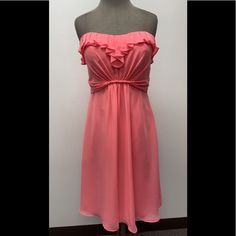 Simple Homecoming Dress. Size: 12 Color: Coral Comes With Straps. Brand New With Tags! 4206 Elegant Flowy Mini Dress For Prom, Strapless Knee-length Prom Dress For Spring, Spring Strapless Bridesmaid Dresses, Strapless Bridesmaid Dresses For Spring, Flirty Strapless Dress For Bridesmaids In Spring, Formal Strapless Chiffon Dress, Spring Chiffon Mini Dress For Formal Occasions, Spring Formal Knee-length Chiffon Dress, Lined Midi Length Prom Dress