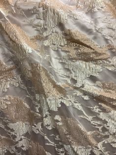 "THIS IS luxurious mulberry 100% organza jacquard brocade design in Italy COLOR: Champagne gold WIDTH :60\" inch made in Italy LENGHTE ; SOLD EVERY YARD MULTIPLE YARDS ARE ONE CONTINUOUS CUT CARE : DRY CLEAN ONLY NEED MORE THAN 20 YRDS AND UP PLEASE SEND US EMIL AND WE CAN ACCOMMODATE YOU SO YOU CAN COMPLETE YOUR PARTICULAR PROJECT DISCLAIMER : WE HAVE MADE AN AFFORT TO PROVIDE FABRICS IMAGES THAT COLSELY REPRESENT THE FABRICS HOWEVER DUE TO ALL THE POSSIBLE VARIANTS (e,g,light source monitor qu Elegant Party Tissue Silk Embroidered Fabric, Elegant Beige Embroidered Fabric For Festive Occasions, Gold Jacquard Fabric For Formal Occasions, Formal Gold Jacquard Fabric, Elegant Beige Fabric For Wedding, Elegant Embroidered Organza Fabric For Parties, Elegant Beige Wedding Fabric, Cream Silk Fabric For Wedding, Elegant Jacquard Fabric For Evening