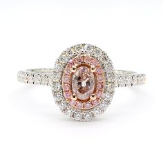 RareGemWorld's intriguing GIA certified diamond ring. Mounted in a beautiful 18K Rose and White Gold setting with a natural oval cut pink diamond. The pink diamond is surrounded by round natural pink diamond melee and round natural white diamond melee. This ring is guaranteed to impress and enhance your personal collection! Total Weight: 0.71cts Natural Fancy Brownish Pink Oval Cut Diamond Measurements: 4.90 x 3.36 x 2.29 mm Carat Weight: 0.28cts Clarity Grade: I3 Natural Round Pink Diamonds Natural Round White Diamonds 18K White Gold Size 6 1/2 Free sizing upon request All diamonds are guaranteed natural International Shipments: Please note that customers are responsible for all import duties and taxes applicable to the country of shipment Returns: Returns accepted in original format with Pink Diamonds, White Gold Set, Gold Cocktail Ring, Gold Cocktail, Oval Cut Diamond, Gia Certified Diamonds, Pink Diamond, Oval Diamond, Cocktail Ring