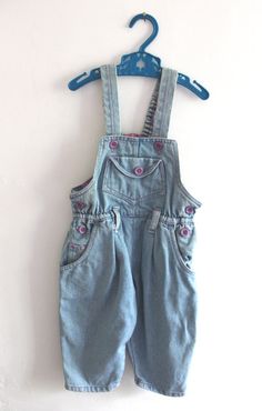 VINTAGE 1980's, very cute dungarees / overalls, heavyweight cotton denim fabric, purple buttons and overstiching, numerous pockets, elasticaterd waist at the back, cute patterned lining at the top, made in Europe. Estimated size 18 months  Vintage condition level 5, new old stock ( washed once ) We assess the condition of our vintage items on a scale from 0 to 5. Level 5 corresponds to an almost new vintage condition. Any defects are systematically reported. Even though in very good condition, v Cute Dungarees, Denim Dungarees, Level 5, Dungarees, Denim Fabric, New Vintage, Kids Clothing, Vintage Outfits, Overalls