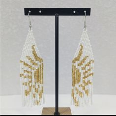 Bohemian Seed Bead Tassel White And Gold Sun Earrings Color: White And Gold That Form The Sun When Put Together New Without Tags In Excellent Condition Elegant Teardrop Beaded Earrings For Beach, White Dangle Tassel Earrings As Gift, White Dangle Beaded Earrings With Tassels, White Chandelier Earrings With Dangling Beads For Festivals, Bohemian White Chandelier Earrings For Festivals, Traditional White Beaded Earrings For Parties, White Chandelier Earrings For Festival, White Latkans Earrings, White Bohemian Beaded Earrings With Dangling Beads