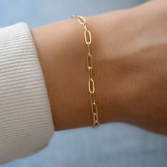 "Dainty paperclip bracelet, perfect for stacking or alone for a minimalist, chic look. - - D E T A I L S - - ▪︎ VERY THICK plating of 14k gold over brass ▪︎ High quality and dainty ▪︎ Measures 6.75\" + .5\" Extension ▪︎ Lobster Claw Closure ▪︎ Nickel-free ▪︎ Each link measures: Bracelets on Model: https://www.etsy.com/listing/911249137/beaded-bracelet-gold-bead-bracelet-gold?ga_search_query=beaded&ref=shop_items_search_3&pro=1 https://www.etsy.com/listing/846628095/evil-eye-red-string-br Simple Diamond Ring, Gold Bracelets Stacked, Paperclip Bracelet, 18k Gold Bracelet, Bracelet Stacking, Red String Bracelet, Gold Armband, Simple Diamonds, Gold Bead Bracelets