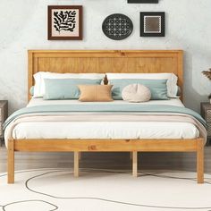 a bedroom with a bed and pictures on the wall