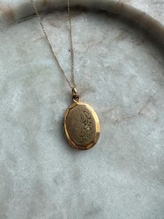 Dimensions:  18" Chain  1" Locket Condition:  Beautiful locket and does have some etching and patina from age, mostly around the trim and divets on the sides.  Captured in photos. Details:  * 14k GF Chain * Stetson Chain Co. Locket 12k GF About the shop: All of the items in my shop were found on some sort of vintage hunting adventure. I love searching through because you really never know what you will find. All item descriptions are short and to the point but if you would like additional information feel free to message me. I also take photos from all angles to give a good accurate visual description so feel free to zoom in. When you shop vintage, you are keeping some amazing memories alive and creating your own as well. At the end of time, these jewels will have lived through so many won Luxury Vintage Locket Necklace, Luxury Vintage Locket Necklaces, Vintage Charm Oval Link Necklace As Gift, Elegant Vintage Charm Oval Link Jewelry, Elegant Jewelry With Vintage Charm And Oval Link, Oval Link Necklaces With Vintage Charm For Gifts, Antique Gold Vintage Charm Jewelry, Gold Locket For Vintage Jewelry Collection, Ornate Oval Jewelry In Antique Gold