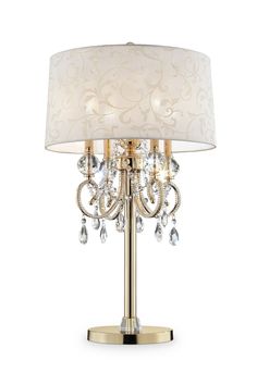 The Aurora crystal chandelier table lamp combine beauty with function. This design features an inner chandelier style light with crystal elements and a barocco drum shade. A charming accent for your living space, chandelier crystal table lamp combine the best of two worlds. Up top is a chandelier style form with gorgeous faceted glass crystals. The crystals appear to be dripping from beneath the barocco shade. Display with shade, or remove it to create a stunning candelabra-like accessory. The solid column base is coated in a yellow gold finish, offering an elegant, old-world feel to the design. Assembly instructions: this fixture comes in 3 different sections. Assemble base to the body pole and connect the light fixtures to the body pole. Place the body harp to the light fixture and place Space Chandelier, Chandelier Table, Chandelier Lamps, Lamp Gold, Crystal Table, French Rococo, Chandelier Table Lamp, Chandelier Crystal, Crystal Table Lamps