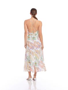 Transport yourself to a tropical paradise with this exotic midi-length dress made of botanical palm print. The lightweight linen fabric provides a breathable feel and drapes beautifully, adding an extra layer of refinement to your look. Ideal for attending a garden party, a beachside soiree, or simply enjoying a leisurely day out, this dress is your go-to choice for effortless style. Botanical Palm Linen Print: 100% Linen Made in the USA of imported fabric Dry Clean Only Length: 52 3/4 inches (s Tropical Print Dress For Garden Party Vacation, Tropical Dresses For Garden Party Vacation, Tropical Dress For Garden Party Vacation, Tropical Style Dress For Garden Party And Vacation, Vacation Linen Dresses With Floral Print, Spring Tropical Print Midi Dress, Tropical Style Midi Dress For Summer Garden Party, Tropical Midi Dress With Tropical Print For Day Out, Green Breezy Midi Dress For Beach