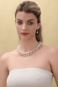 Embrace the opulence of our Vintage Triple-Layer Handcrafted Pearl Necklace, ideal for banquets and weddings. This exquisite piece features three sizes of near-round and oval-shaped pearls, meticulously handcrafted into a luxurious three-layer design. The necklace measures 40cm with an additional 5cm extension, offering flexibility and a perfect fit for any formal attire. Product Details: Pearl Types: Various Sizes, Near-Round and Oval Shapes Craftsmanship: Pure Handcrafted Style: Vintage Luxury Length: 40cm + 5cm Extension Occasion: Perfect for Banquets, Weddings Design: Triple-Layer Pearls This necklace's classic styling and intricate handcrafting make it a stunning choice for anyone looking to add a touch of vintage elegance and grandeur to their ensemble. Product Information Pearl Type Luxury Bridal Pearl Chain Necklace, Teardrop Pearl Necklace With Pearl Charm For Party, Elegant Oval Bridal Necklace For Formal Occasions, Teardrop Pearl Pendant Necklace For Party, Elegant Akoya Pearl Chain Bridal Necklace, Elegant Pearl Beaded Necklaces, Elegant Beaded Pearl Necklaces, Elegant Bridal Necklace With Akoya Pearl And Pearl Chain, Elegant Akoya Pearl Bridal Necklace With Pearl Chain