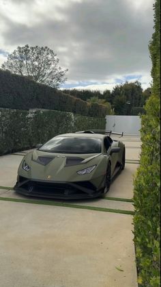 a very nice looking car parked in the driveway