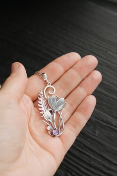 ITEM DESCRIPTION: The size H 5 cm x W 3 cm (2 x 1 inch). Weight - 4 g. You can buy it with a silver chain or without it. I made this unique Crocus pendant of sterling silver, dark amethyst, and moonstone. This is similar to the first spring flowers that appear from under the snow. The floral necklace looks so gentle and elegant! This handmade necklace will come to you in a gift box - ready for gifting. The parcel will be sent 1-2 days after payment. Delivery usually takes 10-21 days. But in the Flower Charm Pendant Necklace Gift For Mom, Elegant Flower Shaped Large Pendant Jewelry, Elegant Flower-shaped Large Pendant Jewelry, Flower Pendant Necklace For Mother's Day, Nature-inspired Flower Pendant Jewelry For Mother's Day, Elegant Floral Large Pendant Jewelry, Unique Flower-shaped Jewelry With Flower Charm, Unique Flower-shaped Jewelry As Gift For Her, Unique Flower Jewelry As Gift For Her