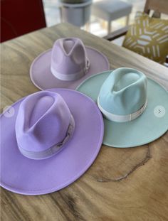 Add some flair to your wardrobe with our Spring Fling Fedora Hat! Available in multiple colors and made from vegan felt, this structured wide brim hat is the perfect accessory for any outfit. It features a matching grosgrain band, a flat and stiff brim, and an adjustable inner drawstring to ensure the perfect fit. With a crown size of 57 cm and a brim of 4 inches, it's a must-have item for any fashion-forward individual! Styling Tip: Add this hat to any outfit to take it up a level! Material Con Luxury Brimmed Felt Hat For Spring, Luxury Brimmed Fedora For Spring, Luxury Brimmed Fedora For Country Events, Luxury Spring Cowboy Hat With Curved Brim, Luxury Curved Brim Fedora For Fall, Luxury Fedora With Short Brim, Luxury Flat Brim Top Hat For Spring, Luxury Brimmed Hat, Luxury Fedora For Country Events With Curved Brim