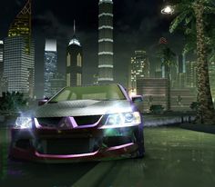 an image of a car driving in the city at night with skyscrapers and palm trees