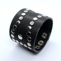 Dominic - oldschool design cuff bracelet for men or women. Wide platform - 5 cm can cover your wrist tattoo and also fix well. Cuff is decorated by rivets of rock style. Made of two layers of genuine leather, edges dyed. Bracelet is adjustable, there are 3 sizes 16,5 - 18 and 19 cm. Can be done in black or chocolate brown color. Suitable for wrist sizes from 16 till 19 cm, to get longer or shorten version contact me. ★ Similar style ★ ----------------------------- JD Matte black watches https:// Cheap Punk Bracelets With Rivets, Punk Style Leather Cuff Bracelet, Edgy Black Cuff Bracelet With Rivets, Punk Cuff Bracelets With Rivets, Punk Black Bracelet With Silver Studs, Black Leather Punk Bracelet With Silver Studs, Black Gothic Leather Bracelet With Studs, Gothic Black Studded Leather Bracelet, Black Leather Bracelet With Studs For Rock Style