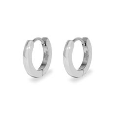 Make a simple statement with this stainless steel huggie earrings. The 1/2 inch flat  chunky hoops style closes securely with a notched post and give the look of a 1/8 inch wide continuous hoop with a soft rounded edge. The durable stainless steel features a high polish finish making it a classic style perfect for both day and evening looks.        Details: • 1/2 Inch Flat Earring Huggies • Soft Rounded Edges • Durable Stainless Steel Hypoallergenic Metal Huggie Earrings, Nickel-free Huggie Hoop Earrings In Stainless Steel, Nickel Free Huggie Hoop Earrings In Stainless Steel, Minimalist Stainless Steel Tarnish Resistant Huggie Earrings, Silver Stainless Steel Hoop Huggie Earrings, Silver Stainless Steel Tarnish Resistant Huggie Earrings, Silver Tarnish Resistant Stainless Steel Huggie Earrings, Silver Stainless Steel Tarnish-resistant Huggie Earrings, Nickel-free Stainless Steel Huggie Earrings