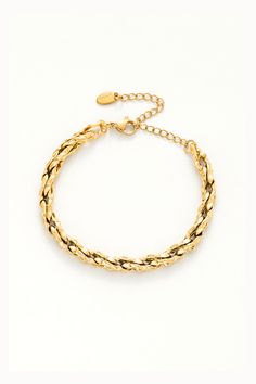 Braided to perfection, this bracelet adds a touch of sophistication to any wrist. Timeless Chain Link Bracelet With Lobster Clasp, Chic Tarnish Resistant Metal Bracelets, Chic Gold Stainless Steel Bracelets, Chic Stainless Steel Jubilee Bracelet, Chic Chain Link Metal Bracelets, Chic Metal Chain Link Bracelets, Gold-tone Stainless Steel Bracelets, Timeless Gold-tone Metal Bracelets, Chic Stainless Steel Bangle Bracelet