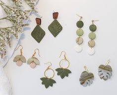 Each earring is meticulously crafted, capturing the intricate details of nature, giving them a sense of unique beauty. Each earring has a peaceful sage color that gives a calming earthy feel. Very lightweight with lots of movement!  Drop length ranges from 1 3/4" to 2 1/4"  Each pair is a one-of-a-kind, handmade with love which may include variations and imperfections.  Please check out our shop for more styles.  Follow us on instagram at @fernie.and.co Everyday Leaf-shaped Jewelry With Matching Earrings, Earthy Dangle Earrings With Ear Wire, Minimalist Leaf-shaped Jewelry With Matching Earrings, Earthy Handmade Dangle Earrings, Handmade Leaf-shaped Nature-inspired Earrings, Nature-inspired Everyday Jewelry With Matching Earrings, Handmade Leaf-shaped Earrings For Gift, Nature-inspired Dangle Earrings, Green Minimalist Pierced Earrings