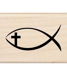 a rubber stamp with an image of a fish and cross on it's side