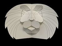 a paper cut out of a lion's head with its eyes closed and ears folded back