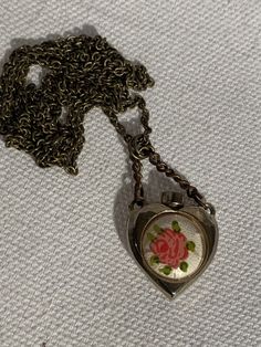 "Vintage item from 1950 32\" old brass chain Antique Perfume Bottle With Enamel ( Guilloche ) Hand Painted Rose Pendant heart with original handle chain measuring 1.5\" Please remember all items are vintage & estate found, therefore do not expect perfection as they may show some wear or imperfections only adding to the character & authenticity. I do my best to accurately describe & photograph all items. Please message me with any questions. Thank You!" Perfume Necklace, Scorpio Necklace, Antique Perfume Bottle, Rhinestone Jewelry Set, Heart Vintage, Pendant Heart, Antique Perfume, Rose Pendant, Vintage Perfume