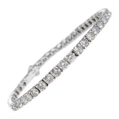 This stunning bracelet is crafted from 14 kt white gold and adorned with 49 round brilliant natural diamonds, totaling 7.72 carats. The F-H color grade diamonds are carefully set to maximize their brilliance and sparkle, creating a piece that exudes luxury and elegance. Certified by GCI for quality and authenticity, this bracelet is a timeless addition to any jewelry collection, perfect for adding a touch of glamour to any occasion. Side Stones: ___________ Natural Diamonds Cut: Round Brilliant Carat: 7.72 cttw / 48 stones Color: F-H Clarity: SI Size: 18 cm Item ships from Israeli Diamonds Exchange, customers are responsible for any local customs or VAT fees that might apply to the purchase. **Import duties and taxes are not included in the item price. The Import process is very simple as Diamond Mine, Love You Babe, Diamond Mines, Bracelet Tennis, White Gold Bracelet, Art Deco Diamond, Tennis Bracelet, Round Brilliant, Diamond White