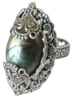 a ring with a large stone in the center and filigrees around it